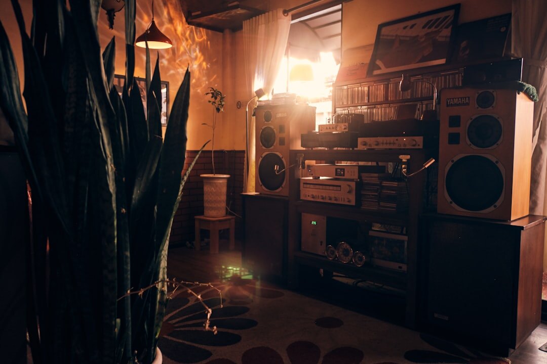 Retro home music studio with vinyl records and analog mixing equipment